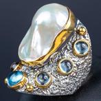 Exclusieve ring in gerhodineerd zilver en goudgeplateerd.