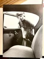 Bob Willoughby - Audrey Hepburn 1954 getting into the car.