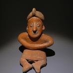 Colima, Westkust Mexico Terracotta Zittend figuur. 12 cm H.