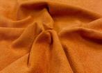 Stevige stof maar met een zeer zachte hand, oranje met een