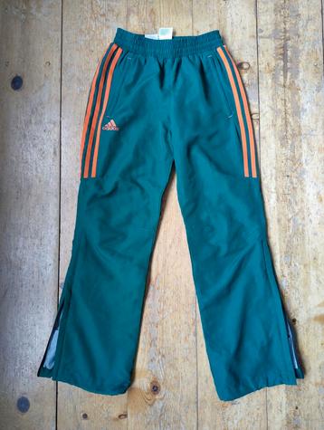 Adidas green sports track pants with orange stripes beschikbaar voor biedingen