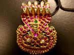 Golden pendant Kaliya which acts as a canopy for a small
