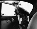 Bob Willoughby - Audrey Hepburn getting into the car (1954)
