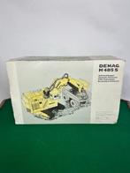 NZG - Modelauto - Mining hydraulic excavator DEMAG H 485 S -, Hobby en Vrije tijd, Nieuw