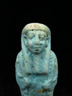 Oud-Egyptisch Faience Ushabti die een schoffel en een