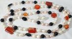 Natuurlijke zoetwaterparels (symbool van zuiverheid), onyx