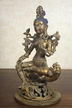 This is a 35 cm tall statue of Green Tara Bodhisattva with a