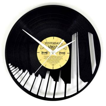 Nieuwe vinyl klokken o.a. pianotoetsen, gitaar beschikbaar voor biedingen