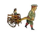 Distler - Zeldzame jongen die een meisje in een kar trekt,