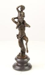 Figuur - A BRONZE SCULPTURE OF A FAUN WITH LITTLE BACCHUS, Antiek en Kunst
