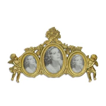 A RESIN TRIPLE PHOTO FRAME FLANKED BY PUTTI