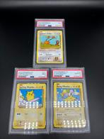 Pokémon - 3 Graded card - Flying & Surfing Pikachu +, Hobby en Vrije tijd, Verzamelkaartspellen | Pokémon, Nieuw