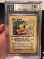 Pokémon - 1 Graded card - Jolteon 4/64 First edition -, Hobby en Vrije tijd, Verzamelkaartspellen | Pokémon, Nieuw