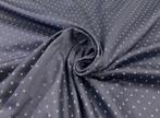 Blauw jacquard stof met een micro-stippenpatroon in