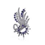 Broche 18kt witgouden broche met blauwe saffier en diamant