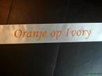 Ivory lint 70 mm met oranje opdruk +/- 80cm. - eigen tekst, Ophalen of Verzenden, Nieuw