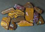 265 ct - Een partij van 12 Australische Boulder-opalen -