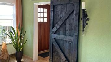Zwart steigerhout loftdeur op maat!