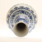 20th century, Chinese Blue and white flower-patterned vase.