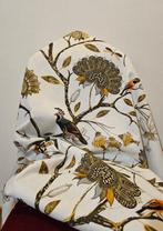 Exclusief Art Deco stof met goudkleurige ooievaar en takken