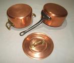 Een degelijke koperen Franse pan met deksel en een steelpan