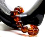 Armband met Baltische barnsteen kralen in cognakkleur. -, Verzamelen, Nieuw