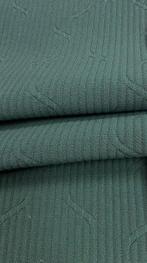 Licht gestructureerde stof, geweven in ton-sur-ton. -