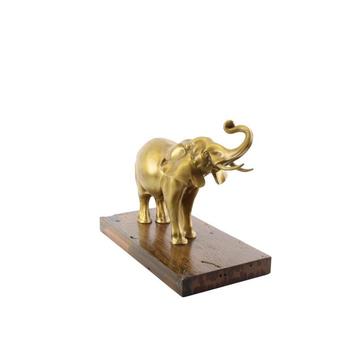 A BRONZE SCULPTURE OF AN ELEPHANT MOUNTED ON A WOODEN PLANK beschikbaar voor biedingen