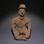 Colima, Westkust van Mexico Terracotta Zittende figuur. 11,5