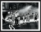 Weegee - Children cool down in the spray from a fire hydrant