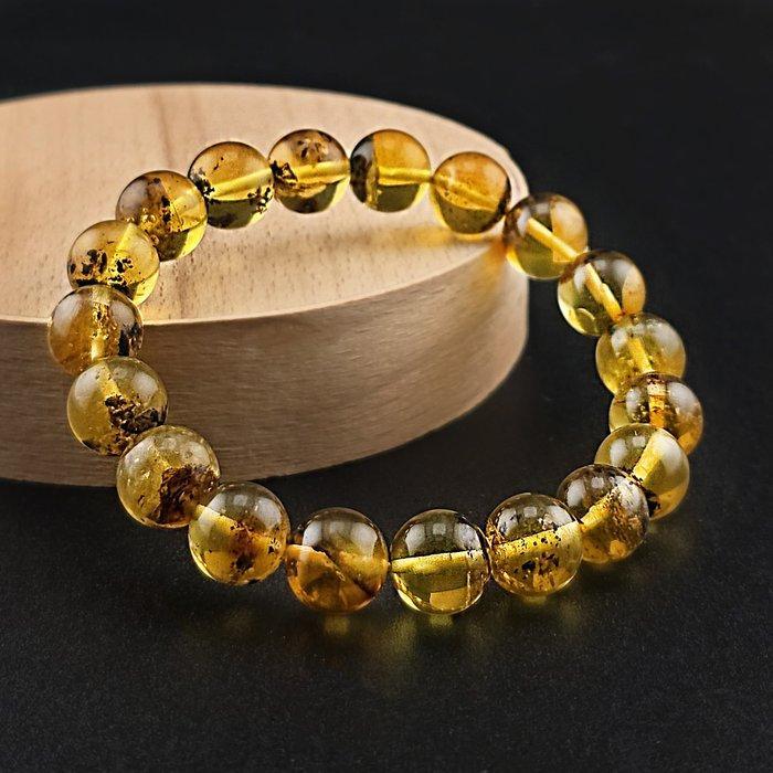 Adembenemende Baltische barnsteenarmband – gouden, Antiek en Kunst, Curiosa en Brocante