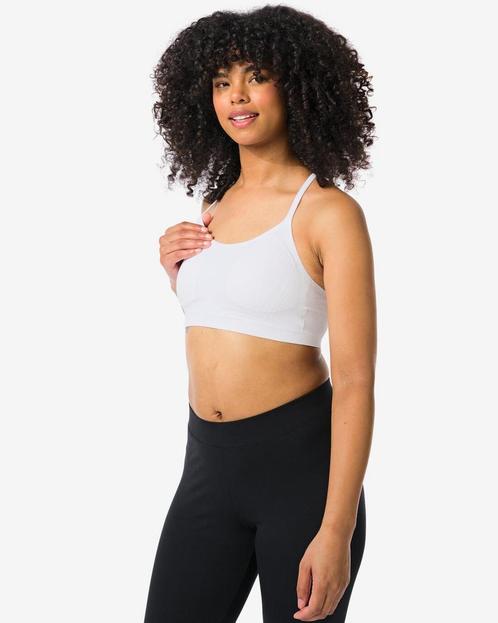 HEMA Naadloze sporttop light support wit 2=35% / 1=20%, Kleding | Dames, Ondergoed en Lingerie, Verzenden