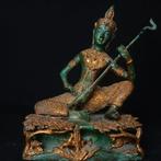 Apsara jouant d’un luth céleste dans un jardin - sculptuur -