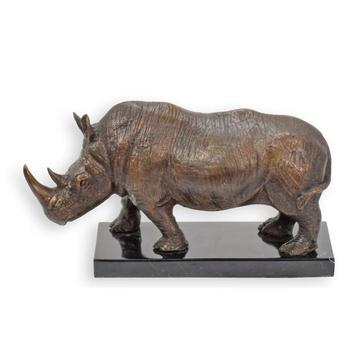 A BRONZE SCULPTURE OF A STANDING RHINO ON A MARBLE BASE beschikbaar voor biedingen