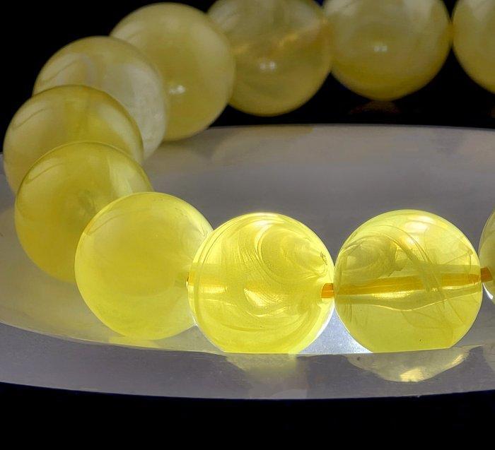 Zeldzame Baltische amber rekbare armband – melkwitte gele, Antiek en Kunst, Curiosa en Brocante