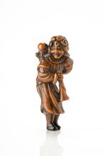 Een fraai buxushouten netsuke van een Nederlander met karako, Antiek en Kunst