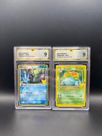 Pokémon - 2 Graded card Mimikyu 136 & Venusaur 015 Foil,, Hobby en Vrije tijd, Verzamelkaartspellen | Pokémon, Nieuw