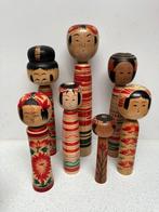 Een indrukwekkende set vintage Kokeshi in verschillende