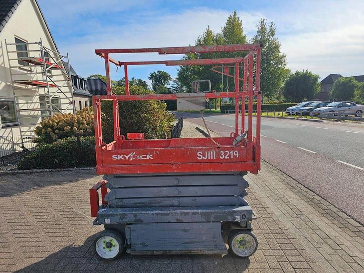 Veiling: Schaarhoogwerker SkyJack SJ3219 Elektrisch 7.8m, Zakelijke goederen, Machines en Bouw | Liften, Steigers en Ladders, Ophalen