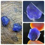 Kavel van 2 tanzanietkristallen. 50,56 karaat. Geen