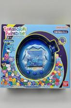 Bandai Namco - Tamagotchi Paradise Blue Water - Handheld, Spelcomputers en Games, Nieuw