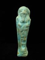 Oud-Egyptisch Faience Ushabti houdt een schoffel en een