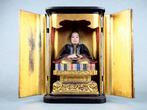 Statue of Sugawara no Michizane enshrined in a shrine -