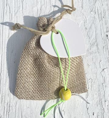 Jute giftbag met gelukspoppetje Tennisbal,pepermunt en kaart beschikbaar voor biedingen