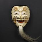 Noh masker - Okina  door Ishizu Gyokushu  (Zonder