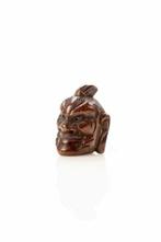 Een mooie expressieve netsuke met het masker van een Ni