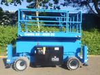 Veiling: Schaarhoogwerker Genie GS-4069DC Elektrisch 14.12m, Zakelijke goederen, Machines en Bouw | Liften, Steigers en Ladders