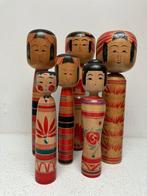 Een indrukwekkende set vintage Kokeshi in verschillende
