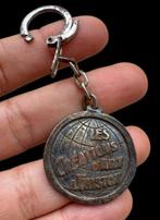 Curieus reclame-sleutelhanger van brons - Hanger - Jaren 60