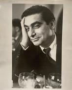 Ruth Orkin - Robert Capa at Magnum luncheon ,Paris, 1952.
